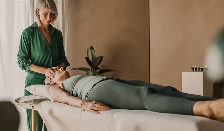 An attendee receiving a 15-minute event massage to release tension and restore energy.