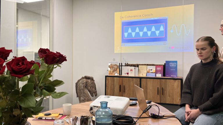 corporate event attendees using HeartMath biofeedback technology to practice heart coherence.